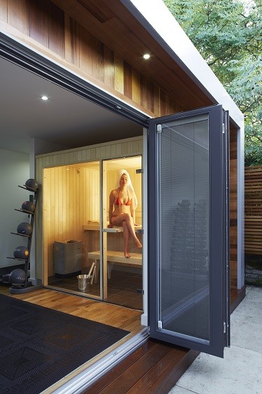 Outdoor sauna with bifolding doors