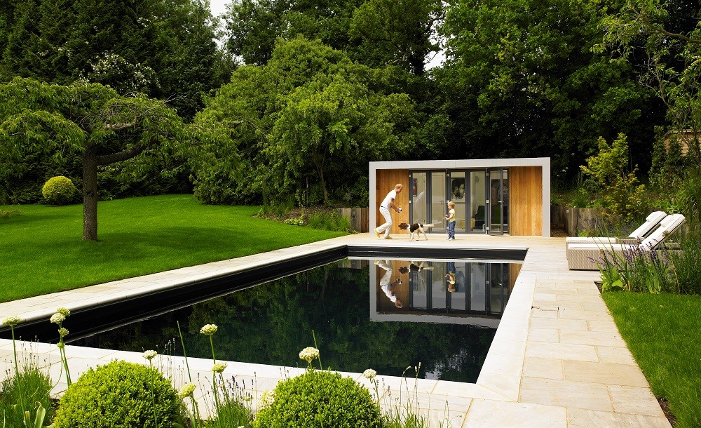 Garden room within a landscaped garden with swimmingpool
