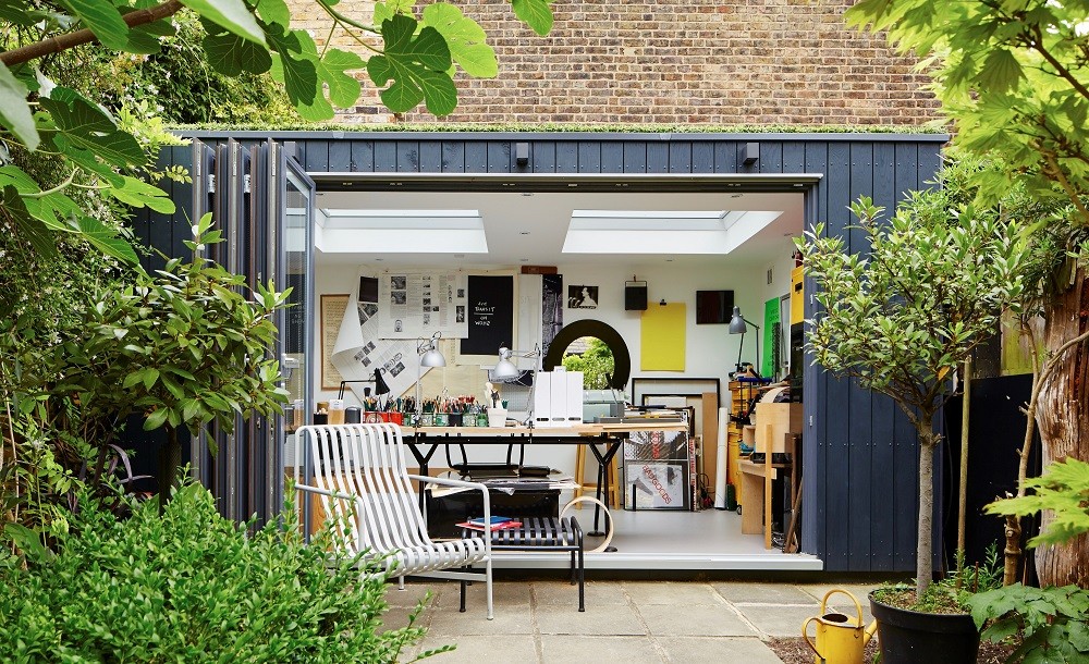 Bespoke garden office with composite cladding, green roof and bifolding doors