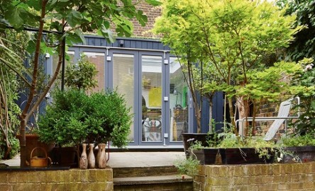 Creative working space in Islington with a grey cladded garden room
