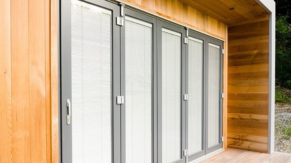 Bifolding doors with integral blinds for a Cuberno garden studio