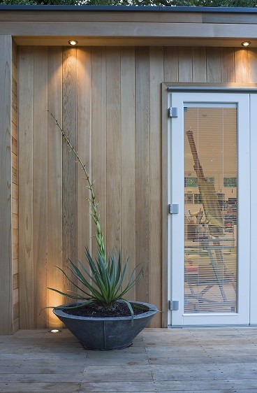 Garden studio with Western Red Cedar cladding and white bifolding doors
