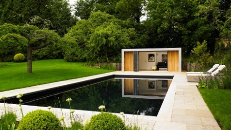 Garden room reflected in a Cookham swimming pool