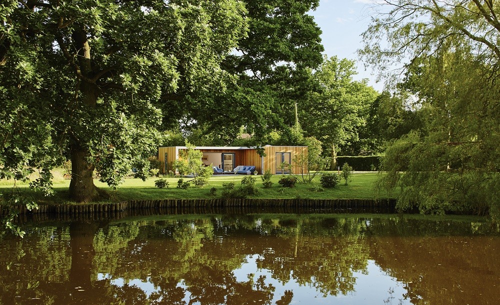 L shaped guest house by the pond